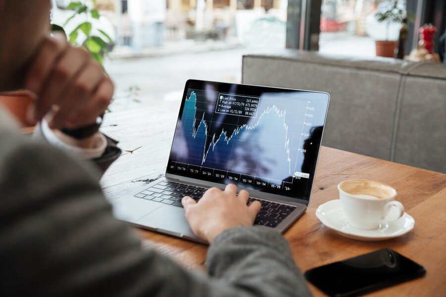 cropped image businessman sitting by table cafe analyzing indicators 171337 5597