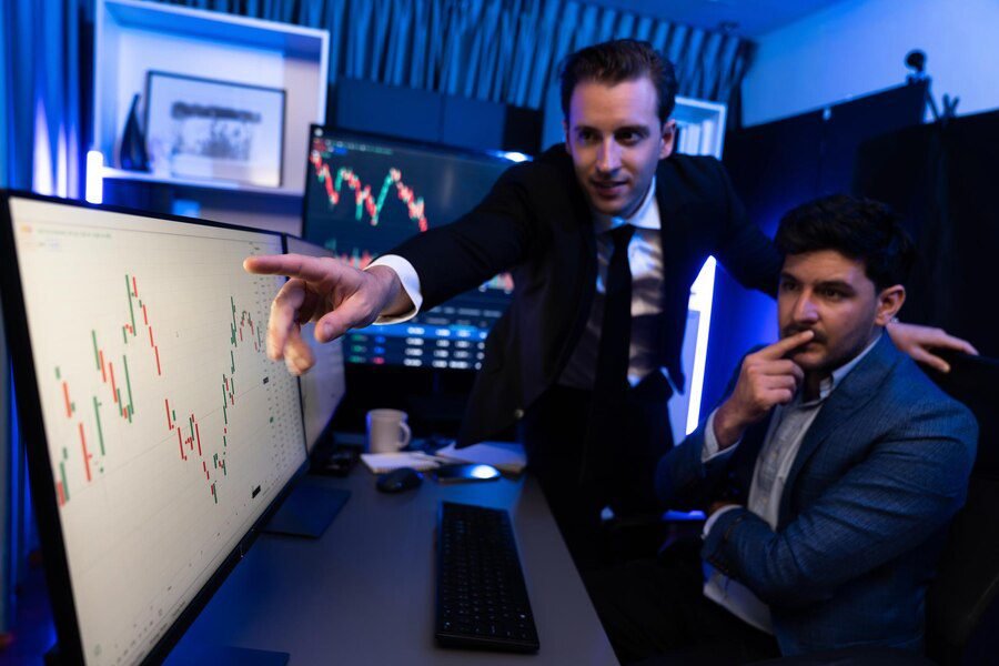 two stock investors pointing interest market stock monitor screen sellable 31965 308311